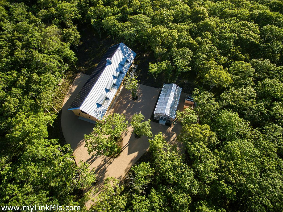 4 Jacob's Neck Road Edgartown, MA 02539 - Photo 2 of 20 an aerial view of a house with a yard and outdoor seating