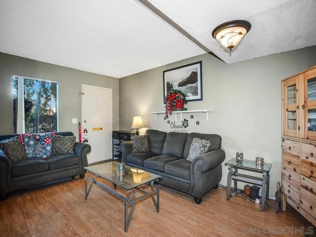 8022 Winter Gardens Boulevard, Unit E El Cajon, CA 92021 - Photo 4 of 30 a living room with furniture and a window