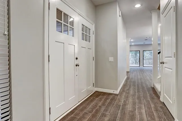 a kitchen with stainless steel appliances kitchen island granite countertop a stove and a sink