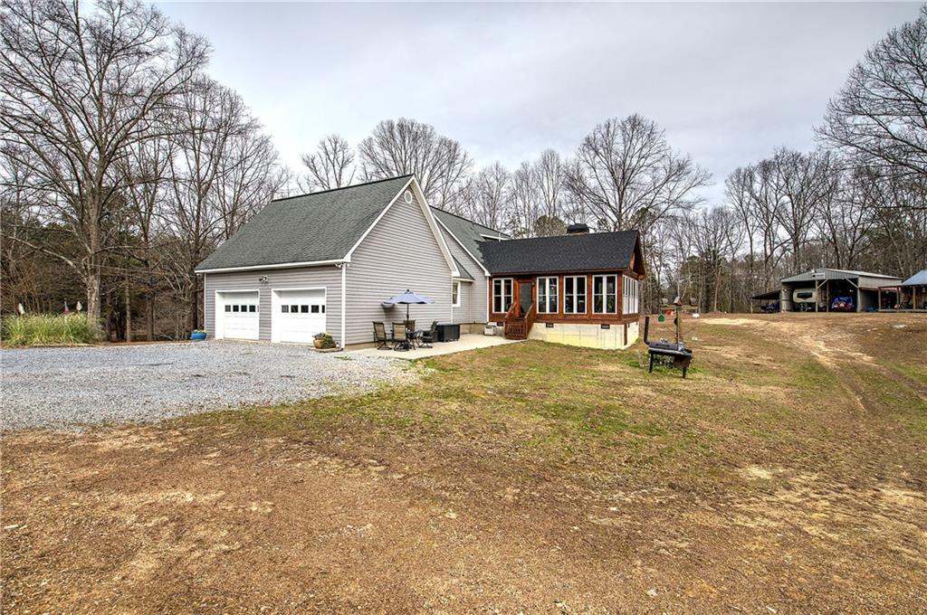 452 Terry White Road Aragon, GA 30104 - Photo 15 of 55 a view of swimming pool with outdoor seating and house in the background