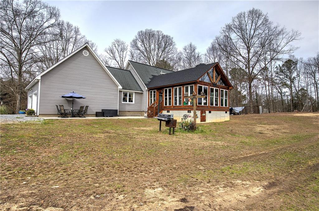 452 Terry White Road Aragon, GA 30104 - Photo 16 of 55 a view of a house with a yard patio and fire pit