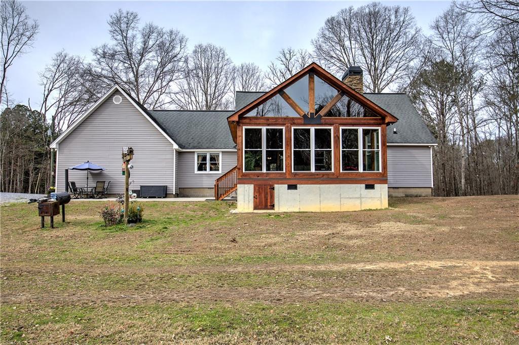 452 Terry White Road Aragon, GA 30104 - Photo 17 of 55 a front view of a house with a yard and garage