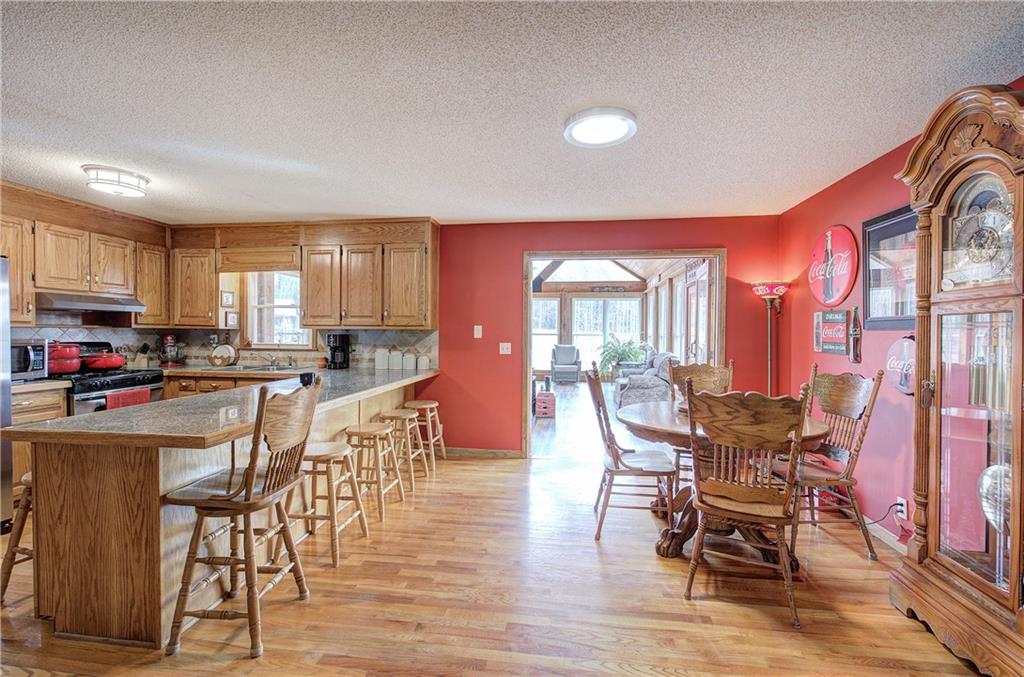 452 Terry White Road Aragon, GA 30104 - Photo 29 of 55 a dining room with furniture a window and wooden floor