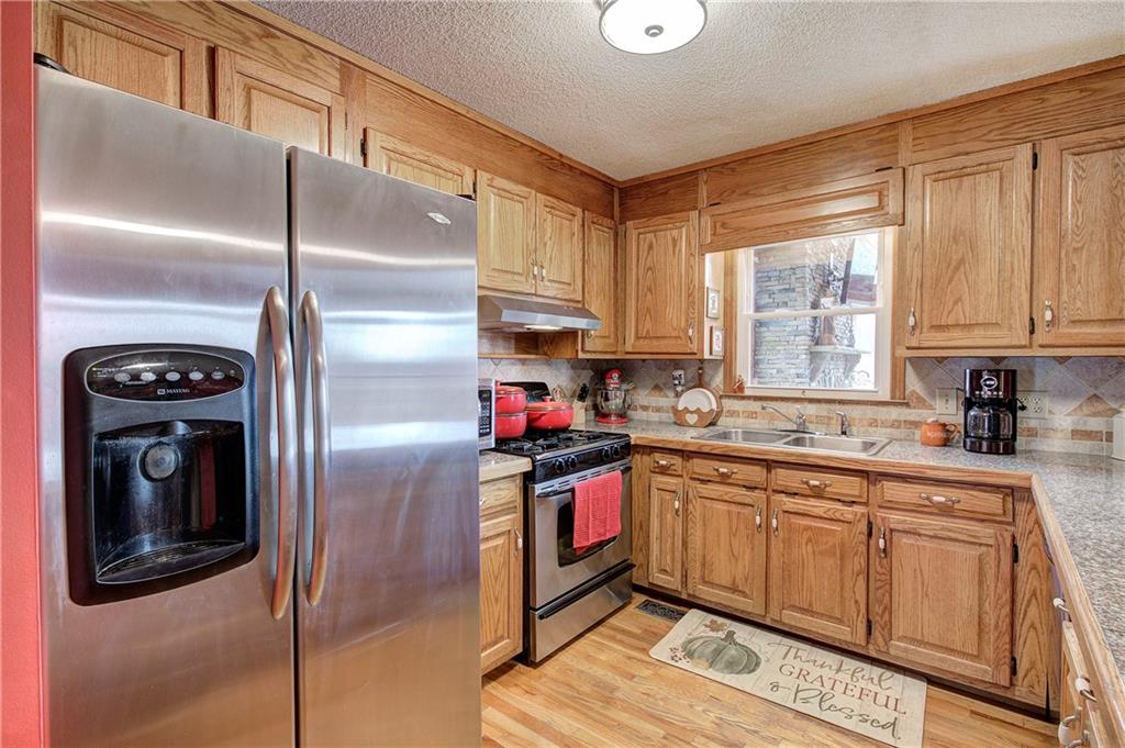 452 Terry White Road Aragon, GA 30104 - Photo 31 of 55 a kitchen with stainless steel appliances granite countertop a refrigerator and a sink