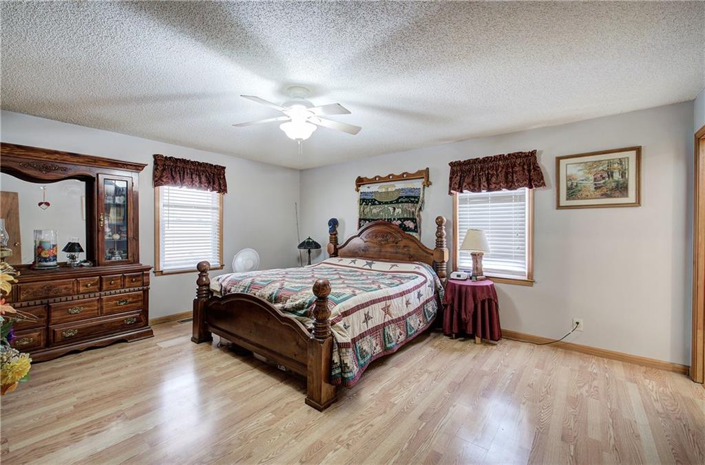 452 Terry White Road Aragon, GA 30104 - Photo 38 of 55 a bedroom with a bed and a chandelier