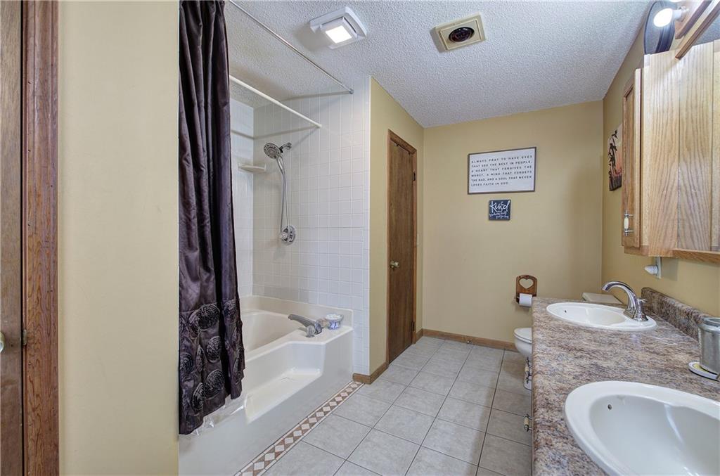 452 Terry White Road Aragon, GA 30104 - Photo 41 of 55 a bathroom with a granite countertop sink and a mirror