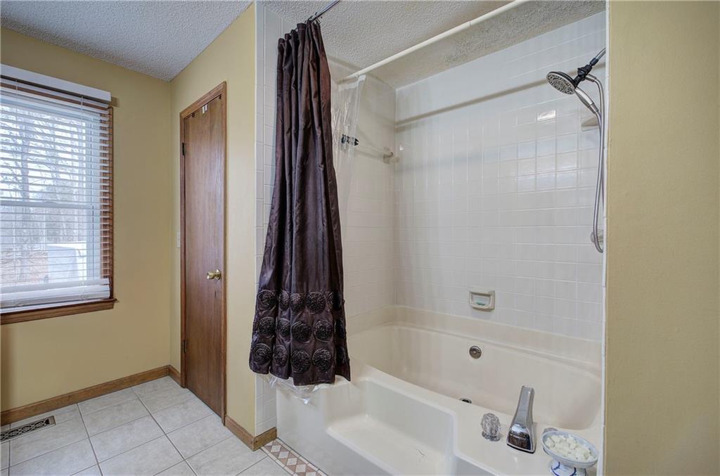 452 Terry White Road Aragon, GA 30104 - Photo 43 of 55 a bathroom with a bathtub and shower