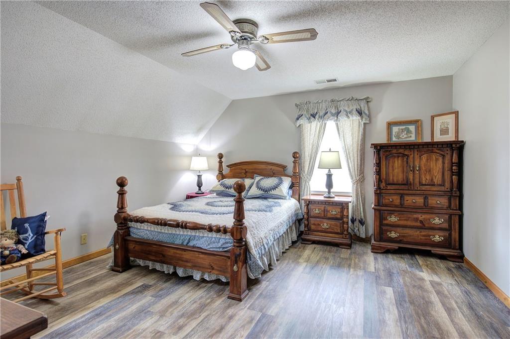 452 Terry White Road Aragon, GA 30104 - Photo 45 of 55 a bedroom with a bed and a chandelier