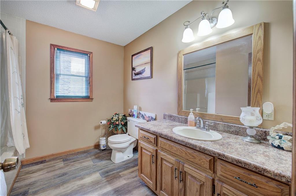 452 Terry White Road Aragon, GA 30104 - Photo 48 of 55 a bathroom with a granite countertop sink a large mirror and a toilet