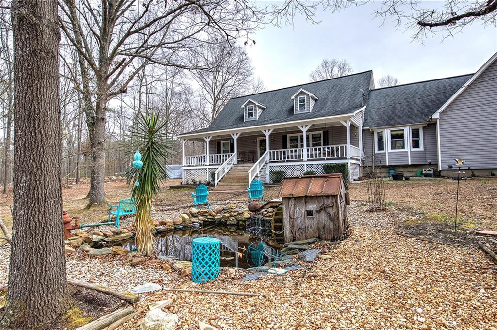 452 Terry White Road Aragon, GA 30104 - Photo 8 of 55 a front view of a house with a yard table and chairs