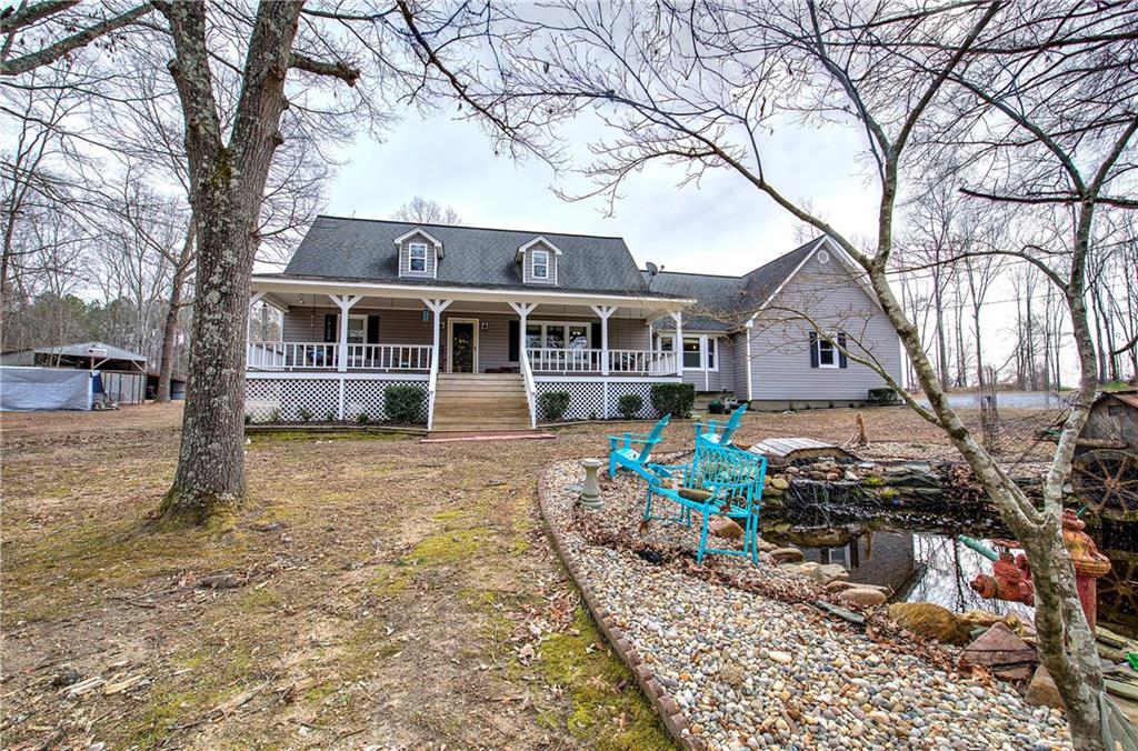 452 Terry White Road Aragon, GA 30104 - Photo 9 of 55 a front view of a house with a garden and trees