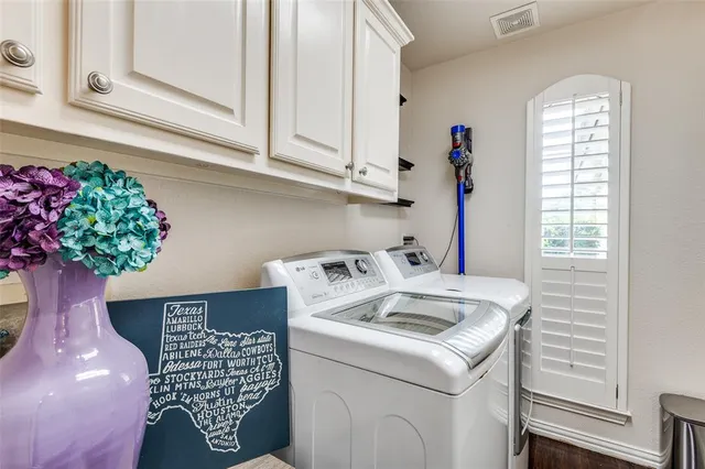 a utility room with washer and dryer