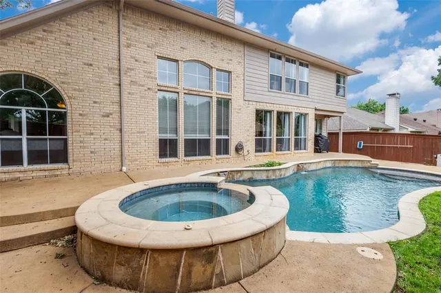 a view of a house with swimming pool