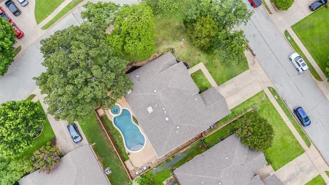 an aerial view of a house with outdoor space