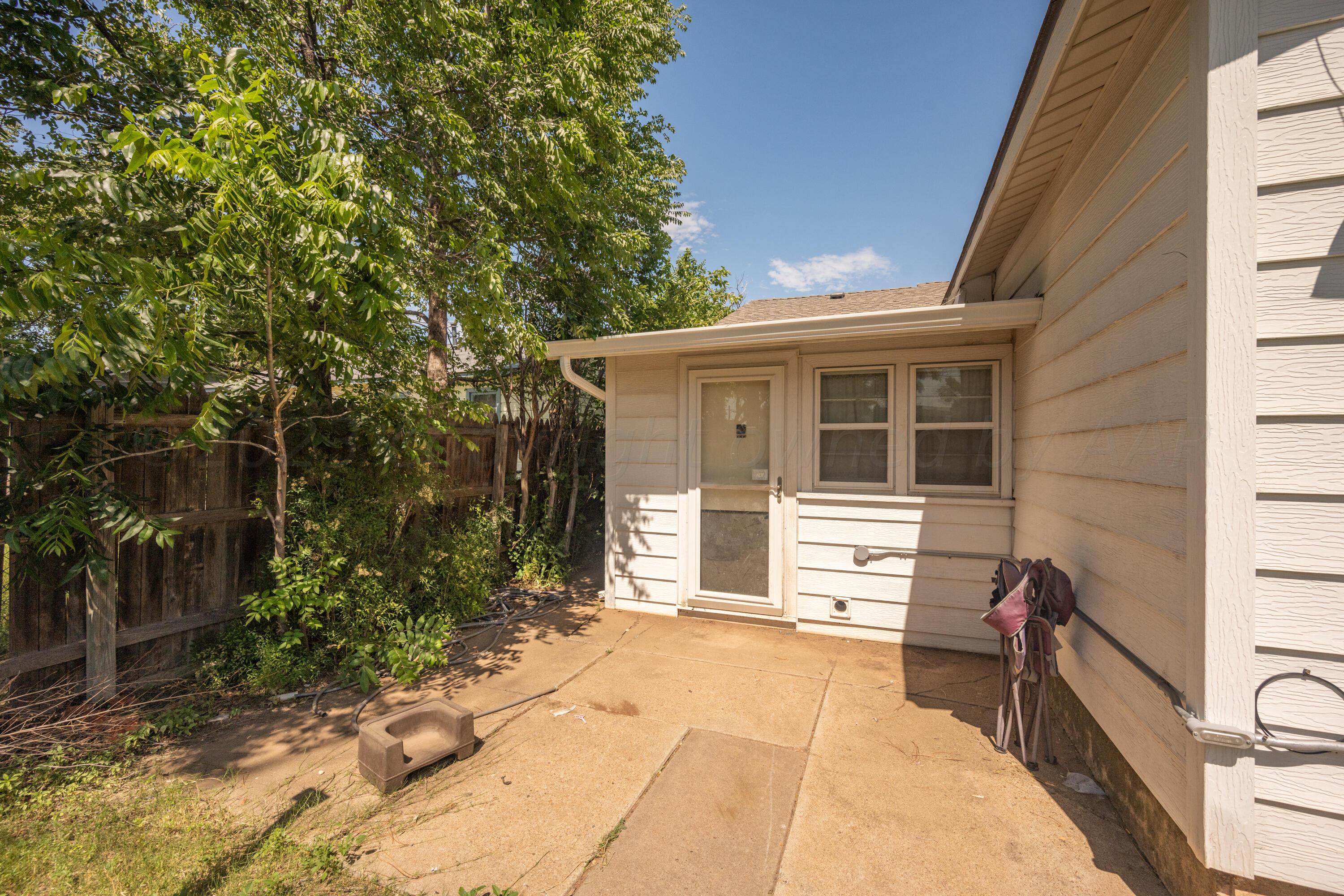 3616 South Travis Street Amarillo, TX 79110 - Photo 24 of 26 a view of a house with a yard