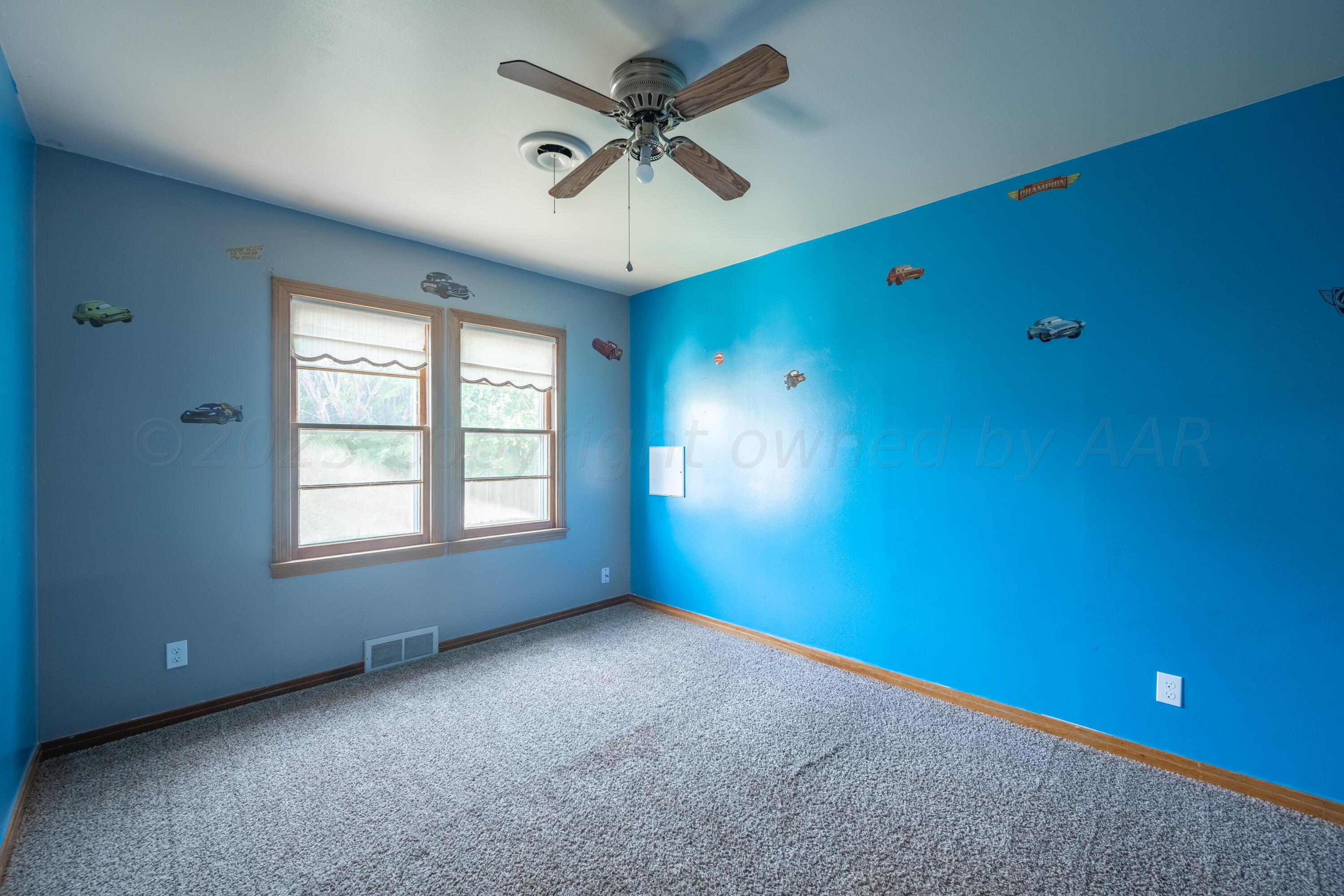 3616 South Travis Street Amarillo, TX 79110 - Photo 8 of 26 a view of an empty room with a window