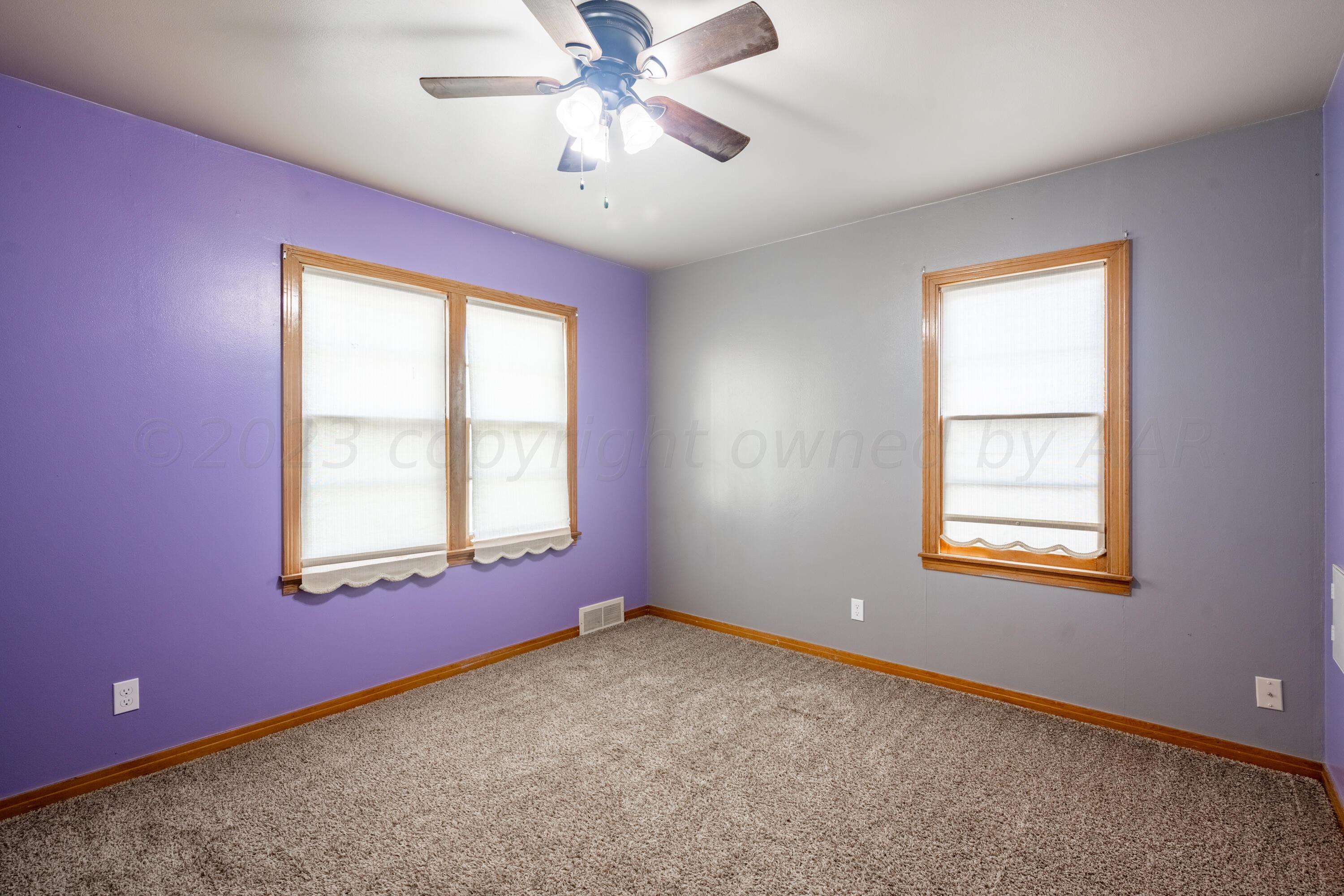 3616 South Travis Street Amarillo, TX 79110 - Photo 10 of 26 a view of an empty room with a window