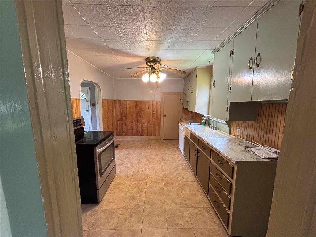 44 Bedford Road West Middlesex, PA 16159 - Photo 3 of 12 a kitchen with granite countertop a sink stove and cabinets