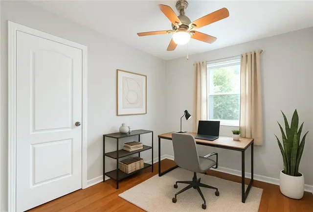 a workspace with furniture and a window