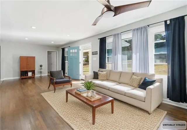a living room with furniture and a window