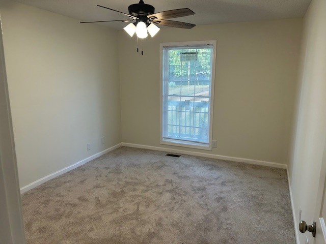 3403 Chaney Lane Clarksville, TN 37042 - Photo 11 of 28 an empty room with a window and a fan