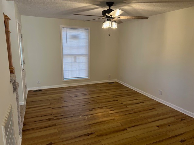 3403 Chaney Lane Clarksville, TN 37042 - Photo 15 of 28 a view of empty room with wooden floor and fan