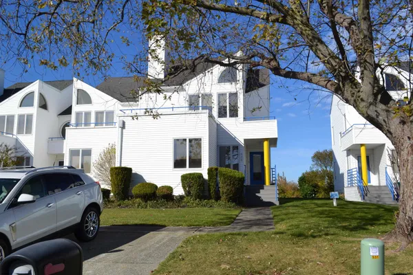 a front view of a house with a yard