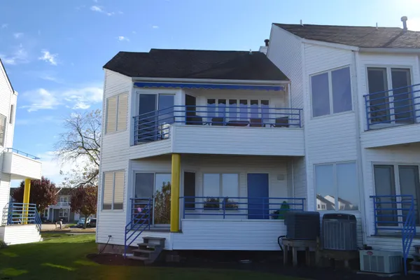 a front view of a house with sitting area