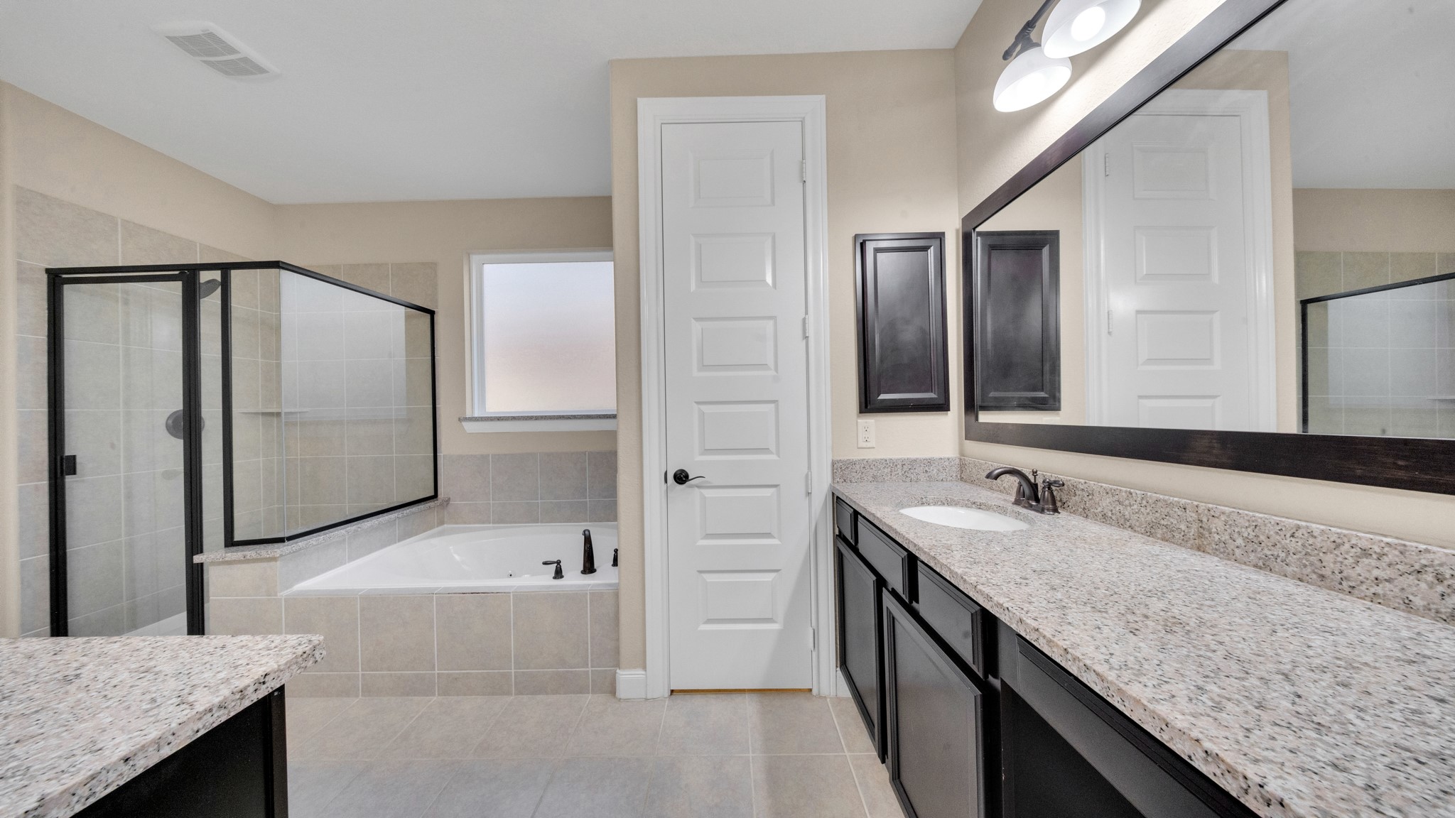 18118 Berry Garden Lane Spring, TX 77379 - Photo 22 of 45 Another angle showing the oversized shower, large soaking tub, and bright natural light.