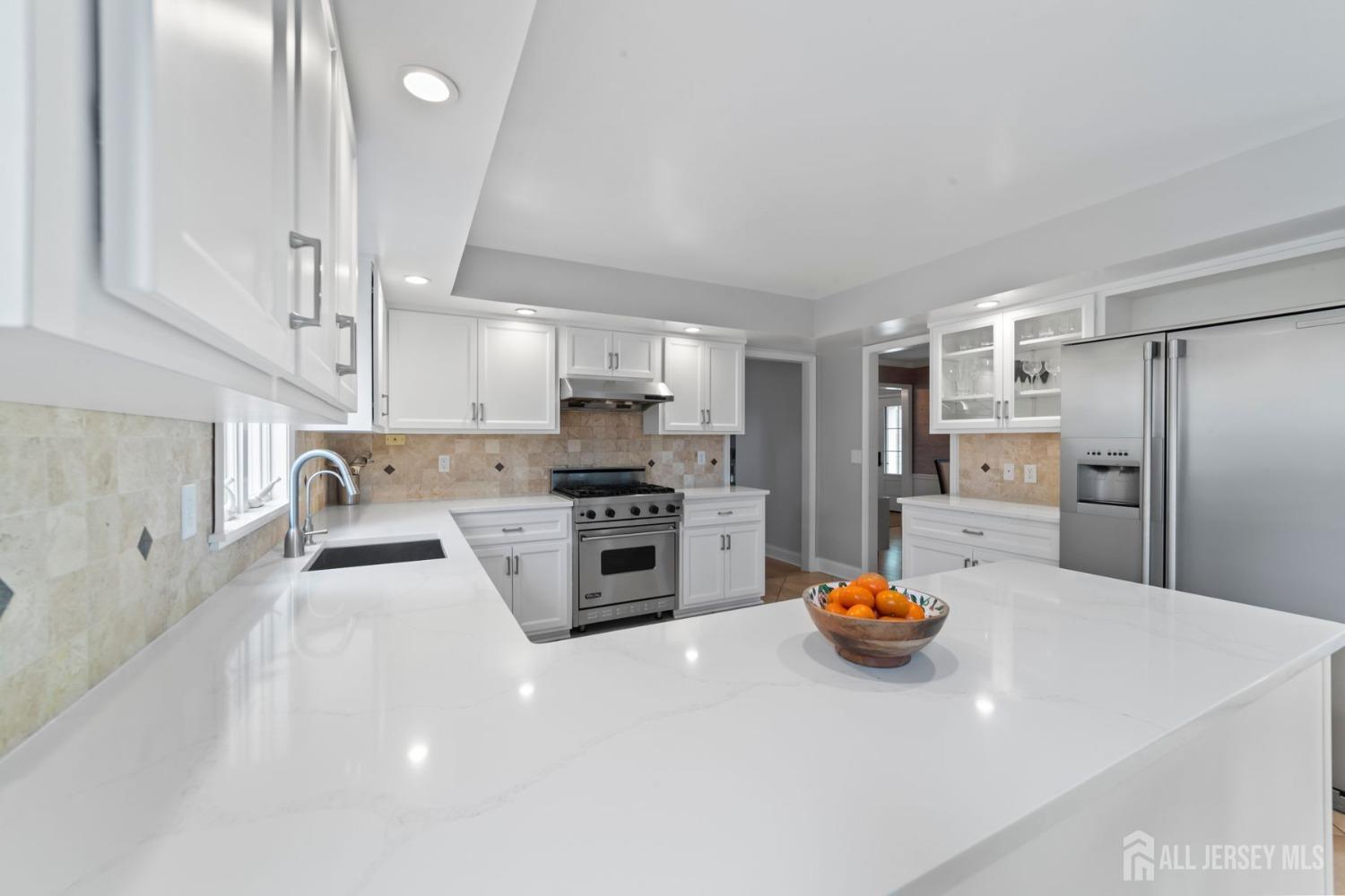 325 Spring Hill Road Skillman, NJ 08558 - Photo 12 of 46 a kitchen with stainless steel appliances a refrigerator sink and stove