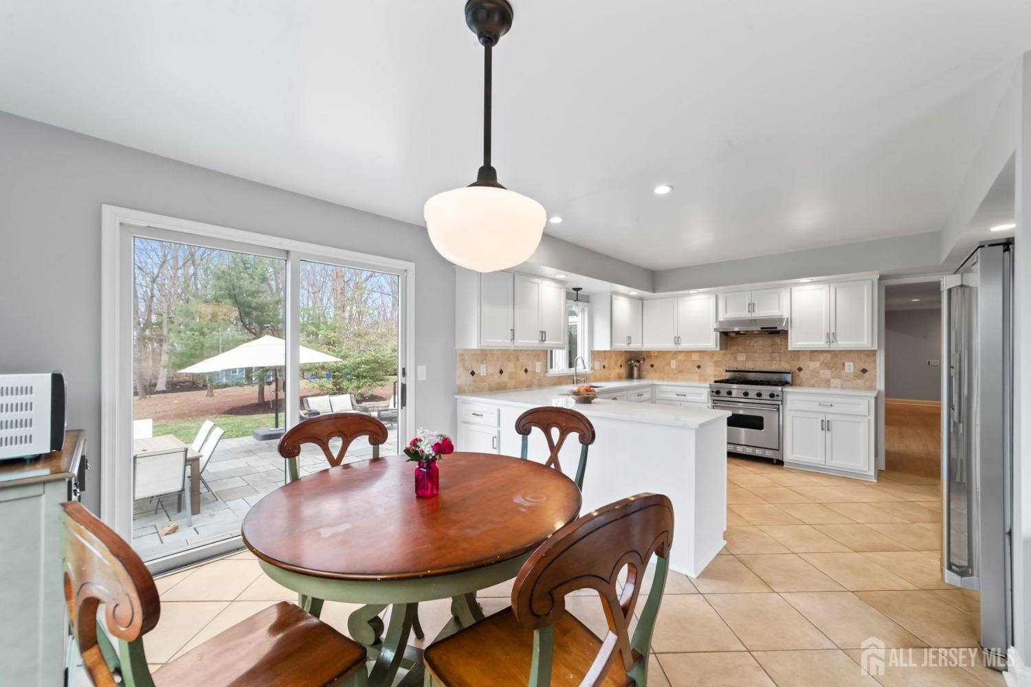 325 Spring Hill Road Skillman, NJ 08558 - Photo 14 of 46 a dining room with furniture a chandelier and window