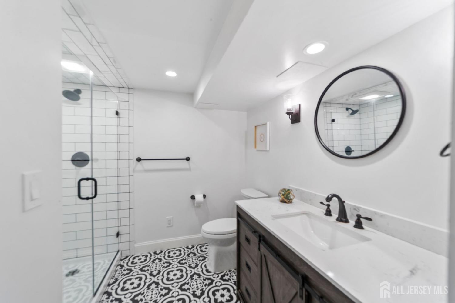 325 Spring Hill Road Skillman, NJ 08558 - Photo 30 of 46 a bathroom with a sink a toilet and a mirror