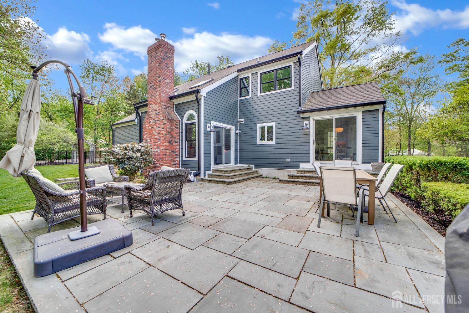 325 Spring Hill Road Skillman, NJ 08558 - Photo 35 of 46 a view of a house with backyard and sitting area