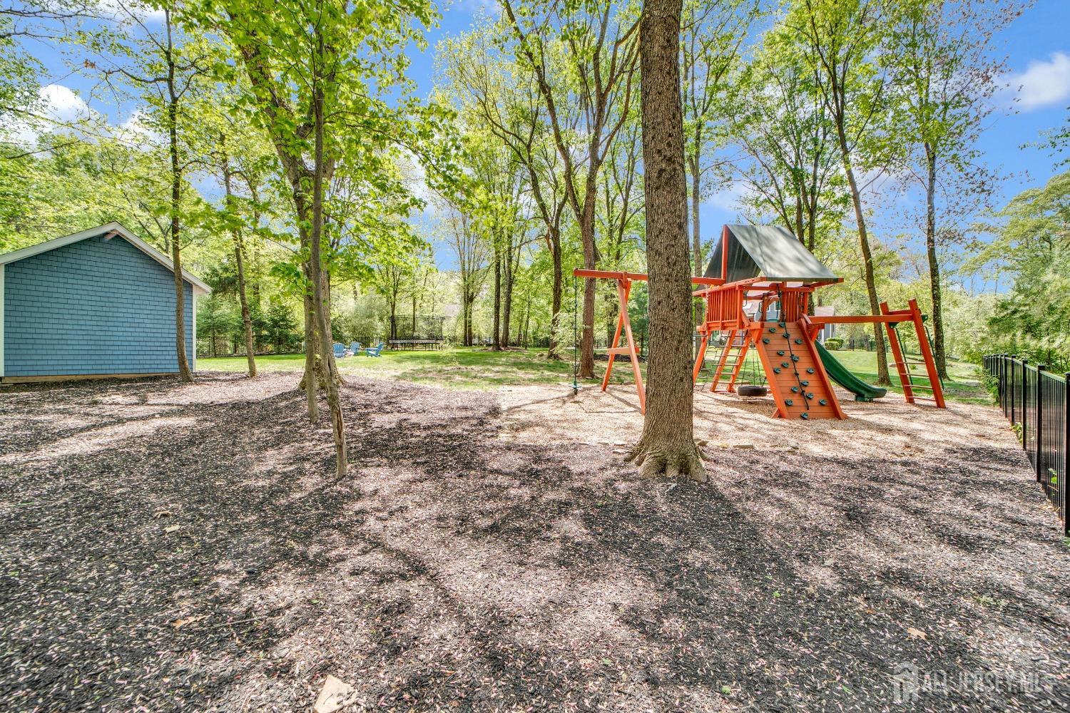325 Spring Hill Road Skillman, NJ 08558 - Photo 37 of 46 a view of outdoor space with deck and tree