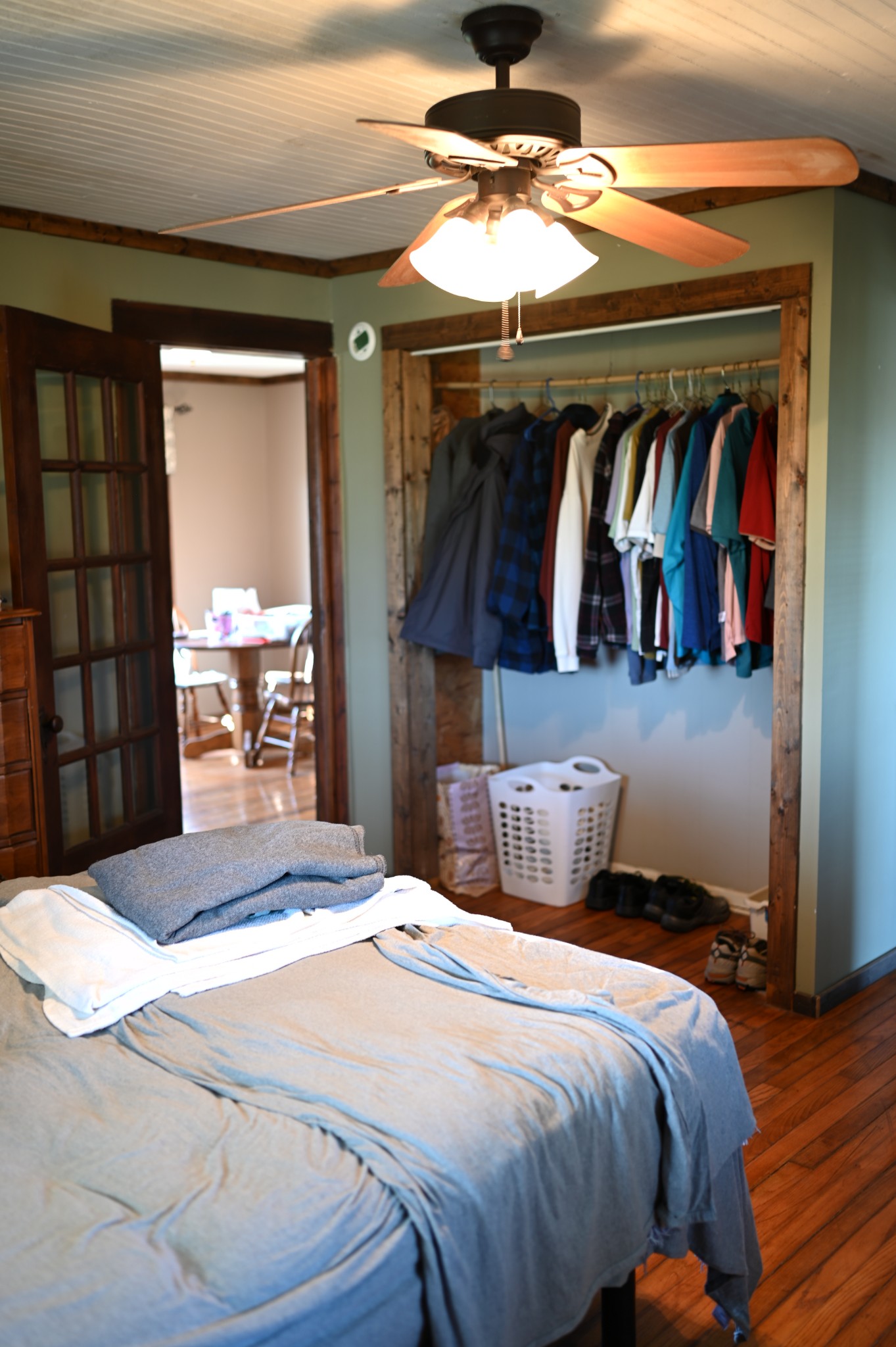 10996 Shelbyville Road Morrison, TN 37357 - Photo 14 of 26 a bedroom with a bed and a chandelier