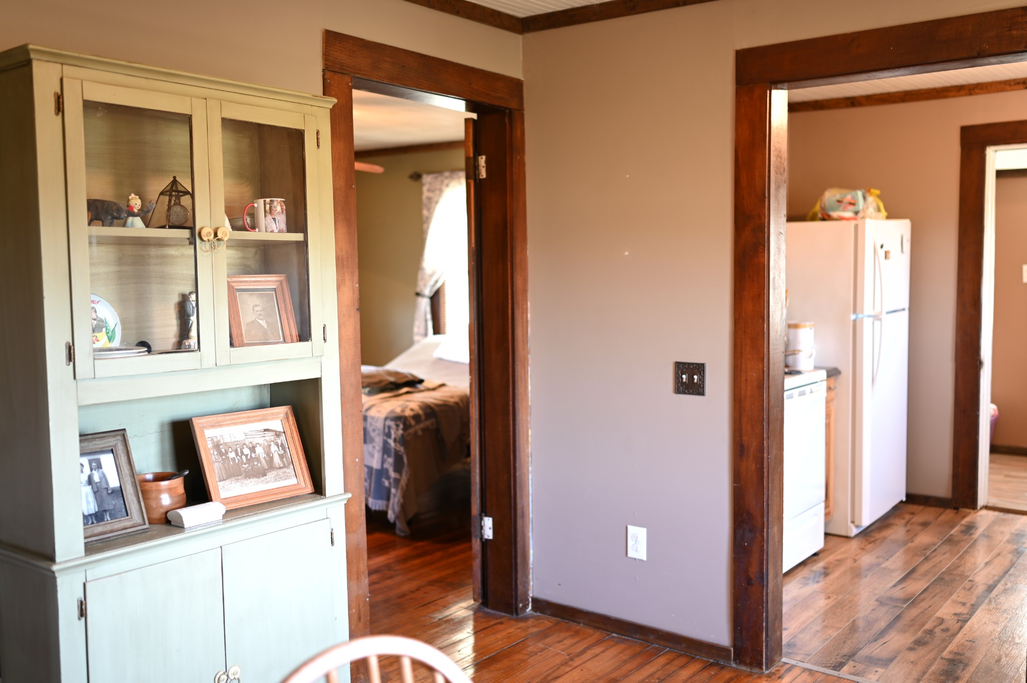 10996 Shelbyville Road Morrison, TN 37357 - Photo 16 of 26 a view of a bedroom with a door and wooden floor