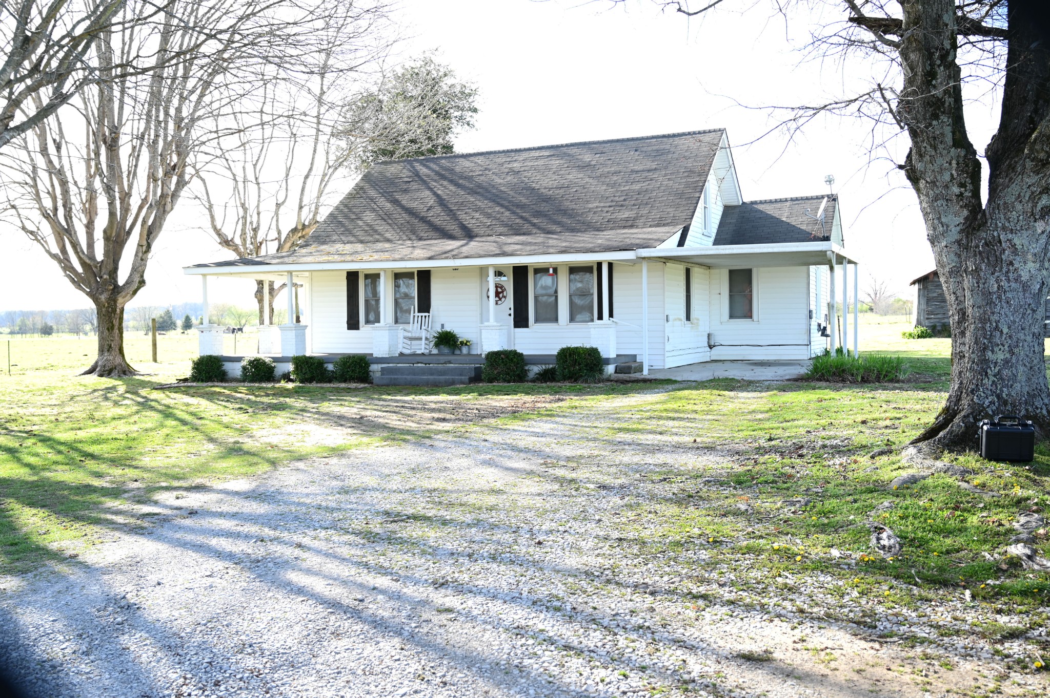 10996 Shelbyville Road Morrison, TN 37357 - Photo 9 of 26 a front view of a house with a yard and trees