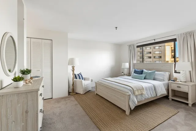 a bedroom with bed and window