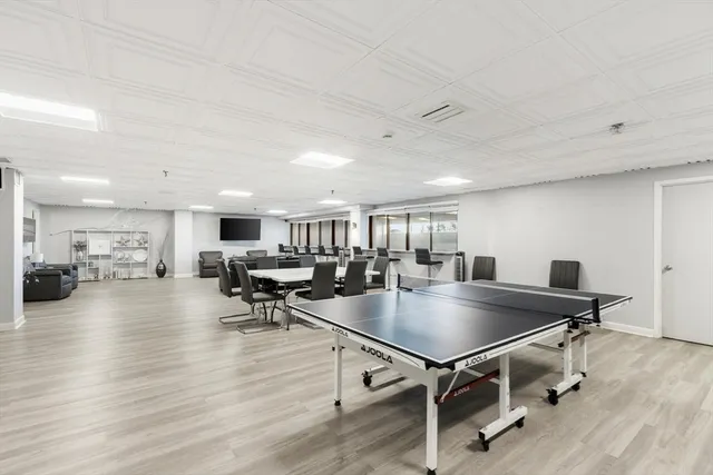 a kitchen with stainless steel appliances granite countertop a refrigerator a stove a microwave oven a sink with island and refrigerator