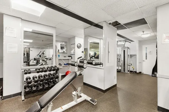 a view of parking area with parked cars