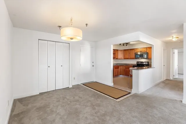 a view of kitchen with cabinets and microwave
