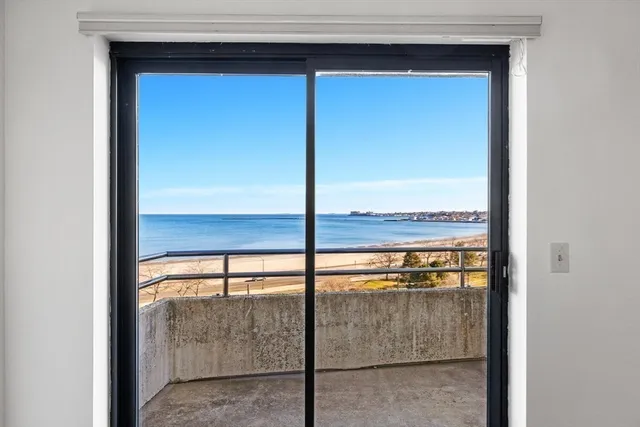 a view of a glass door and a window