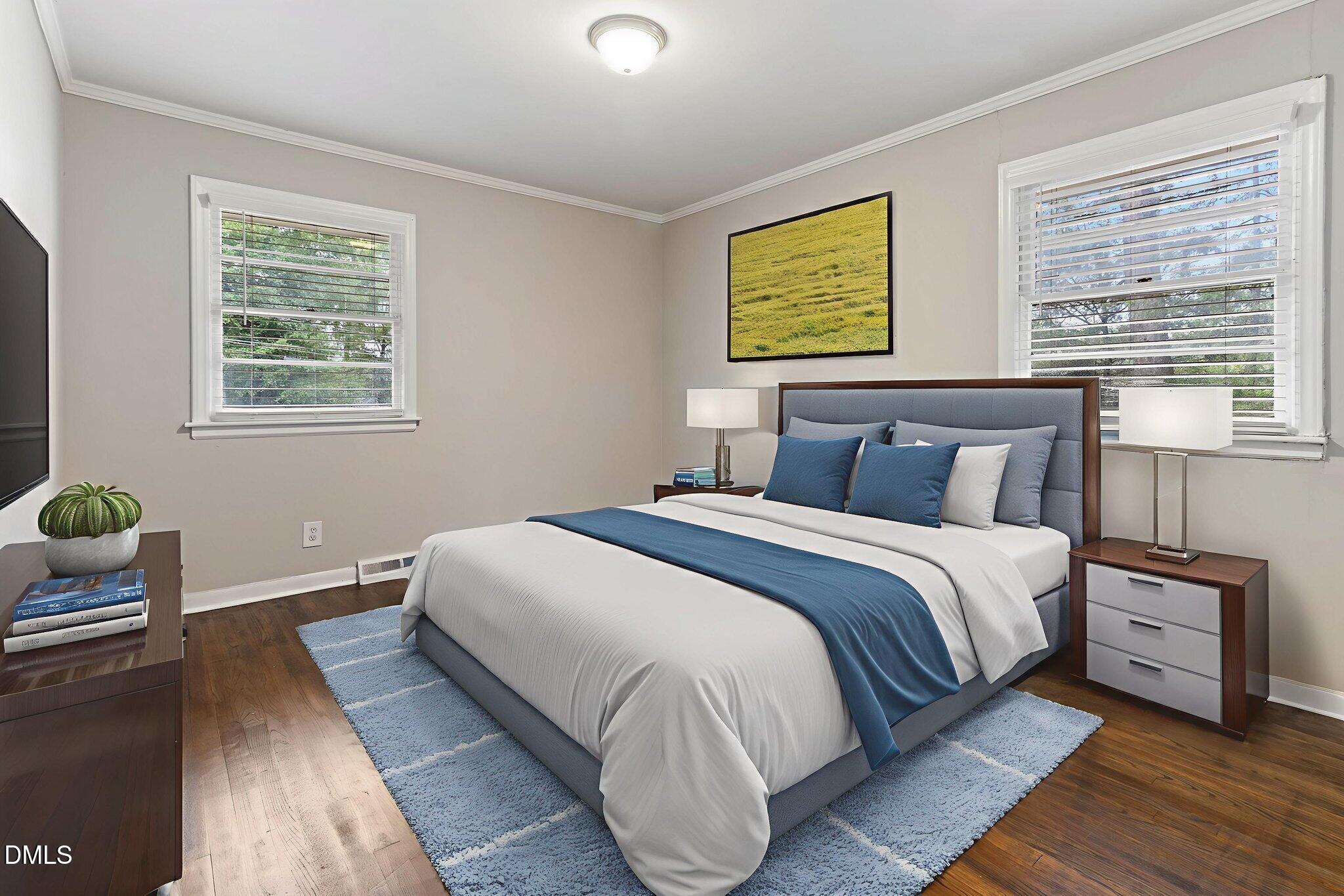 1814 House Avenue, Unit A Durham, NC 27707 - Photo 5 of 12 a bedroom with a bed and wooden floor