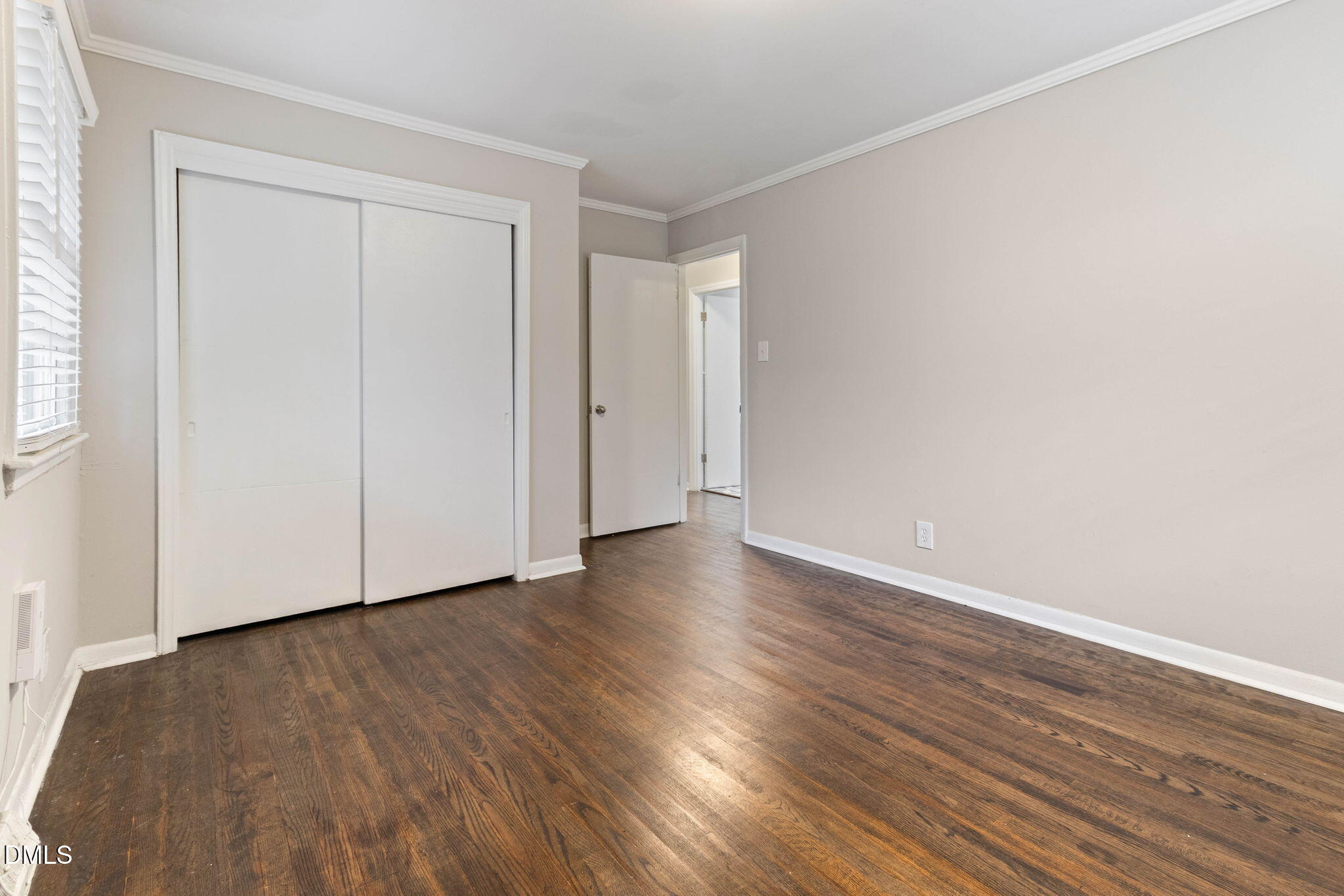 1814 House Avenue, Unit A Durham, NC 27707 - Photo 7 of 12 a view of an empty room with wooden floor and a window