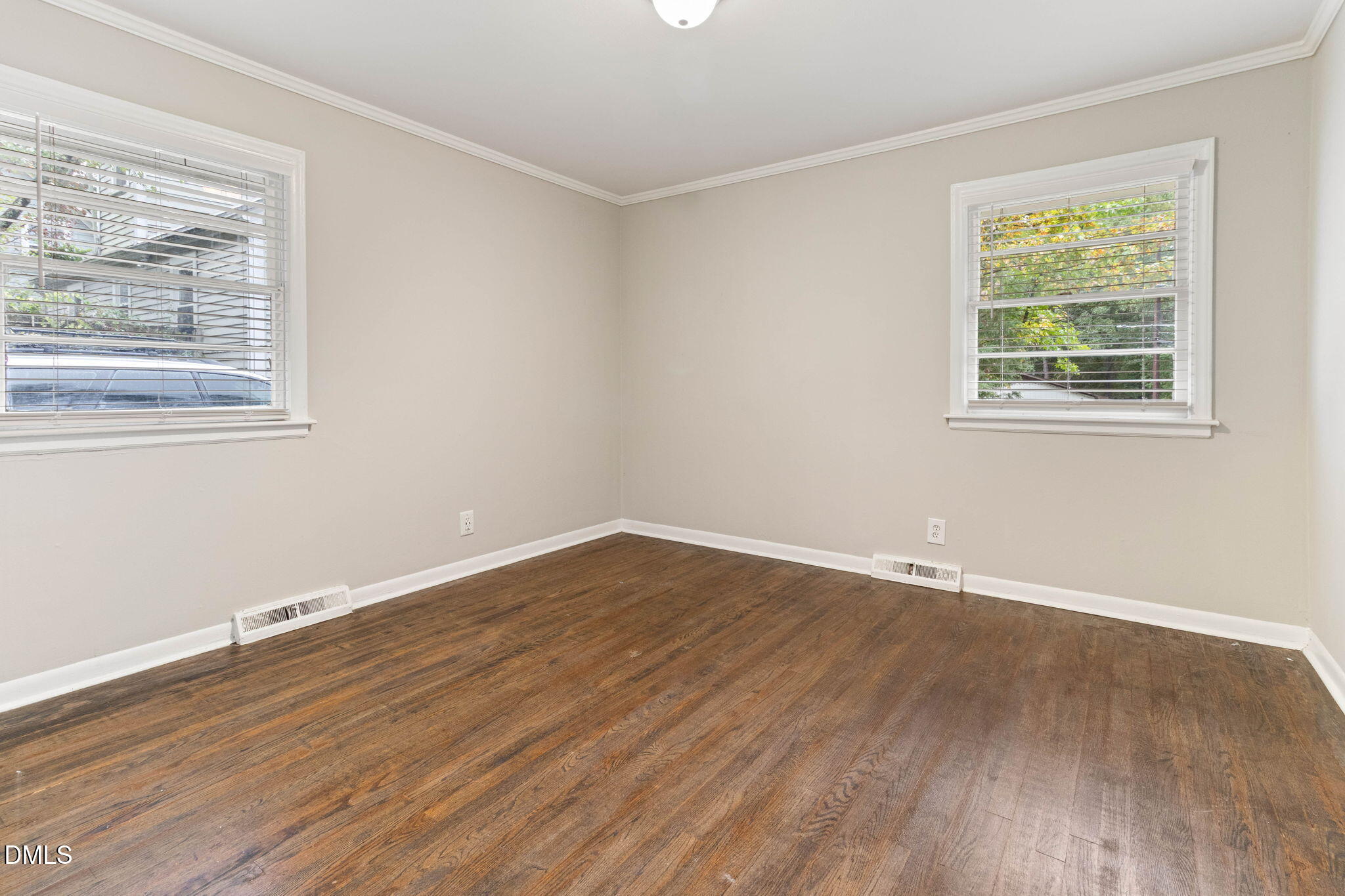 1814 House Avenue, Unit A Durham, NC 27707 - Photo 10 of 12 a view of an empty room with wooden floor and a window