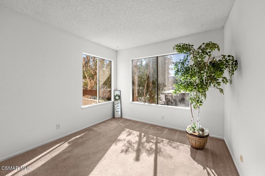 1754 Sinaloa Road, Unit 271 Simi Valley, CA 93065 - Photo 11 of 20 a view of a room with windows and flower pot