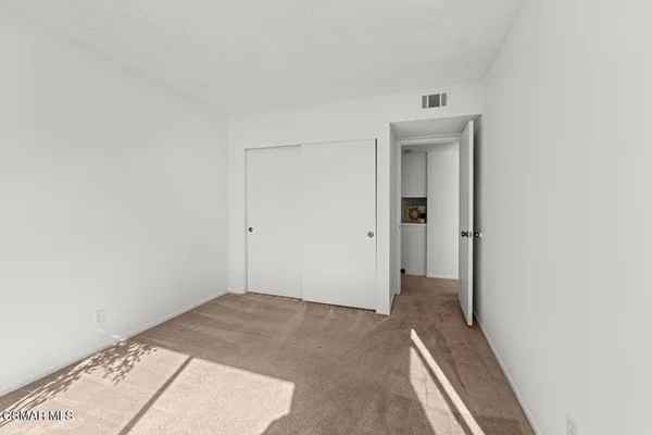 a view of hallway with closet