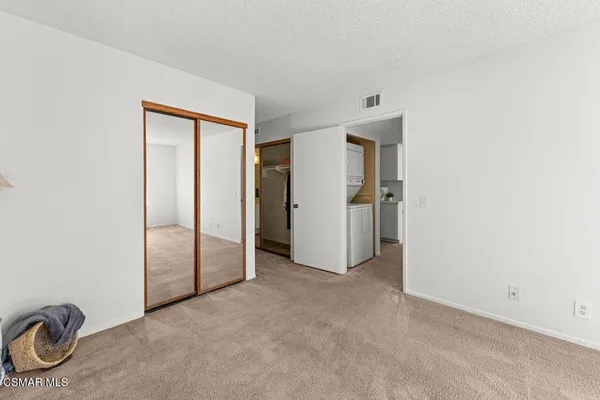 a view of a storage and utility room with closet