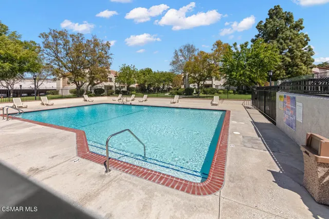 a view of swimming pool with a yard