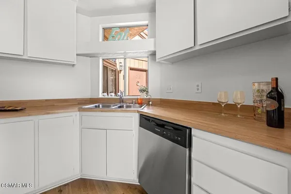 a kitchen with a sink and cabinets